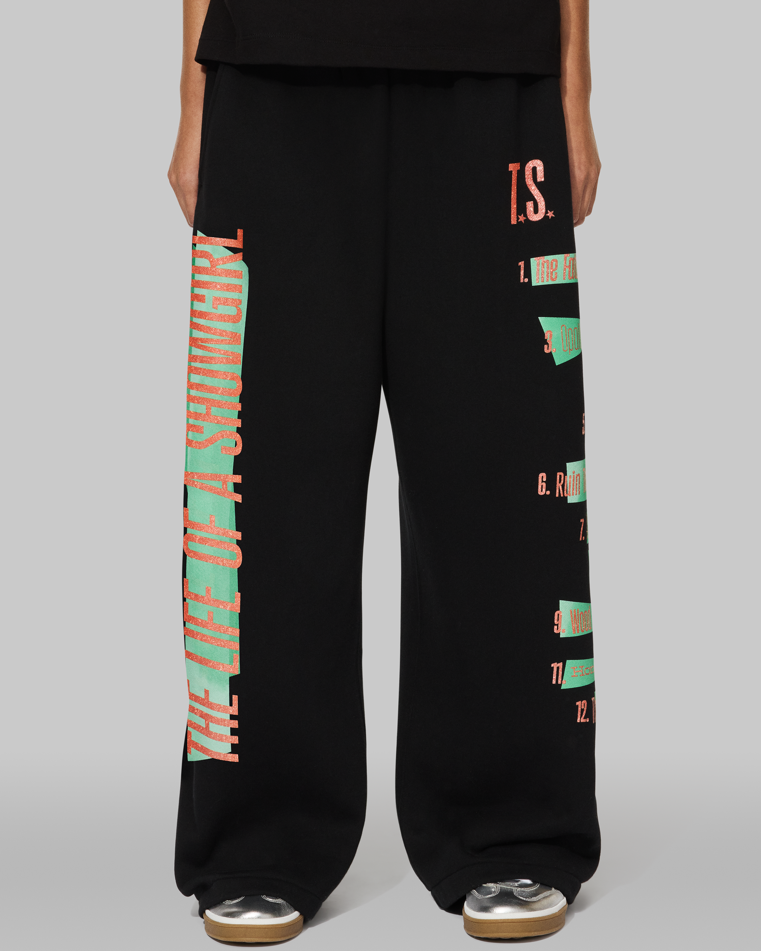 The Life of a Showgirl Tracklist Black Sweatpants Front on Model