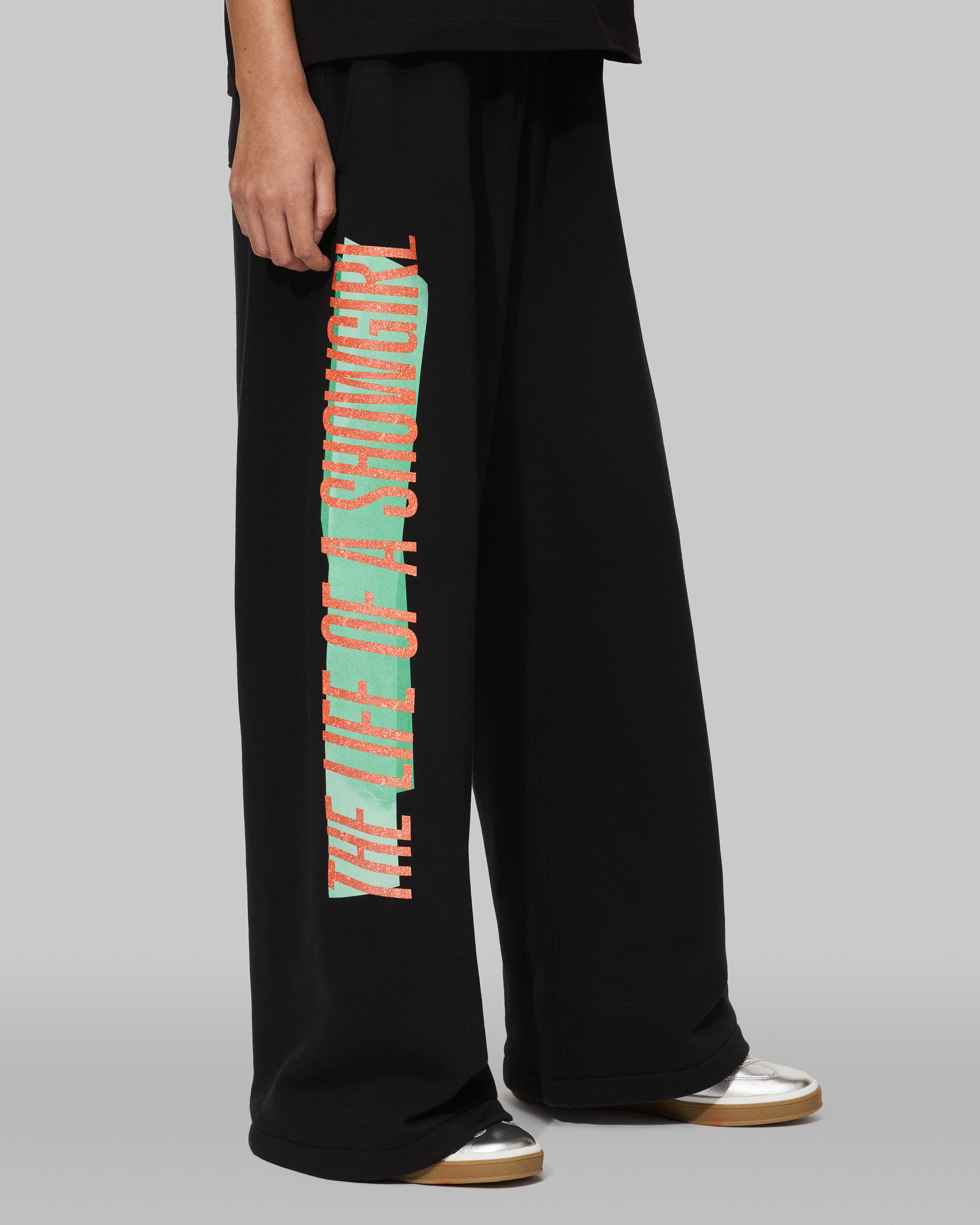 The Life of a Showgirl Tracklist Black Sweatpants Side on Model