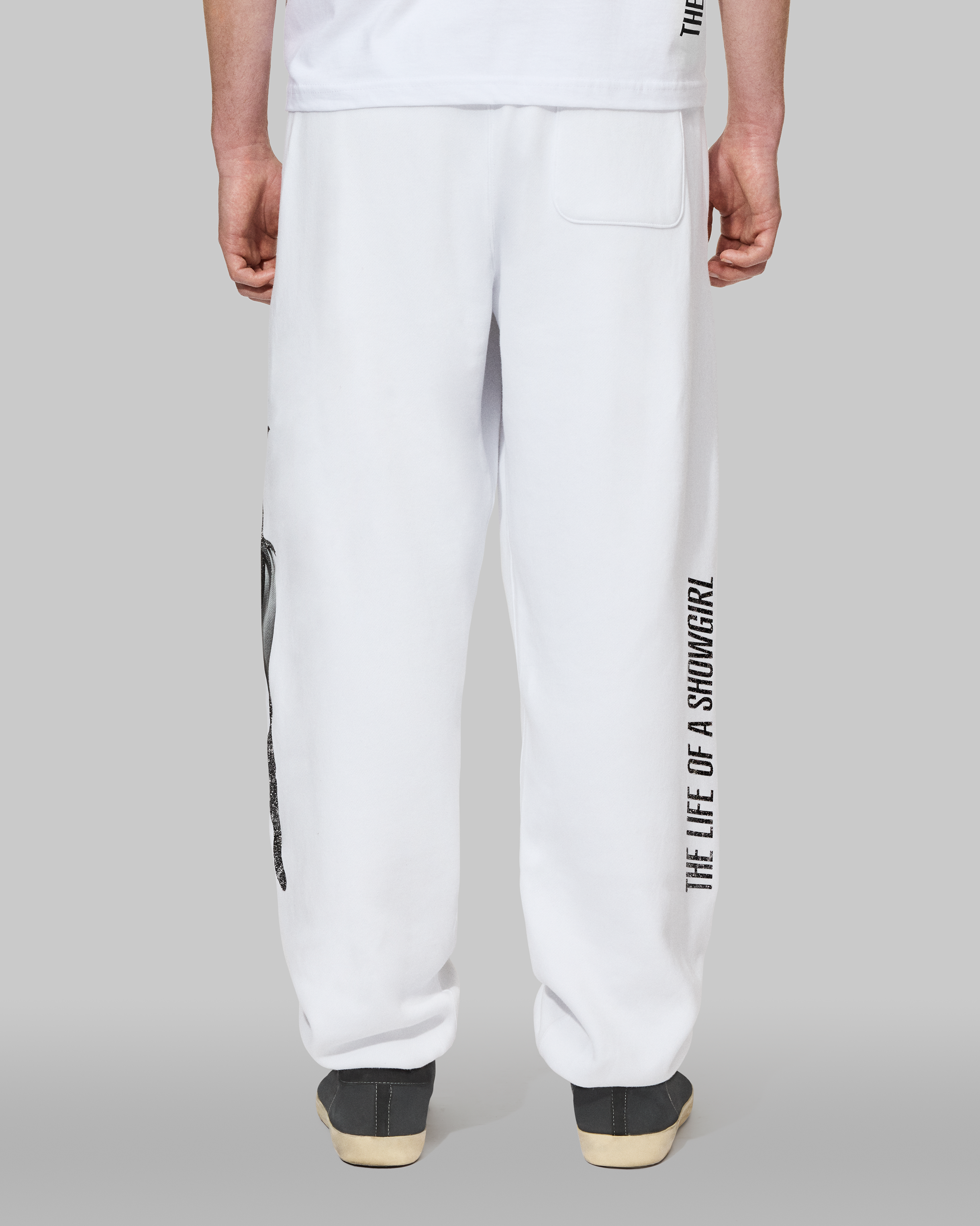 The Life of a Showgirl Shiny Bug White Sweatpants Back on Model